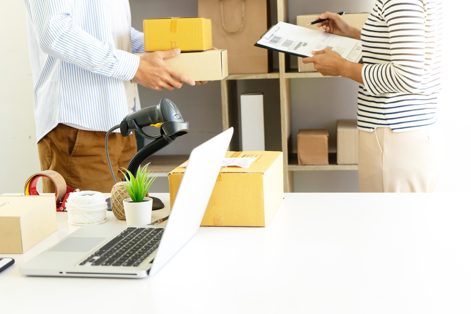 Employees working and improving their eCommerce shipping strategy.